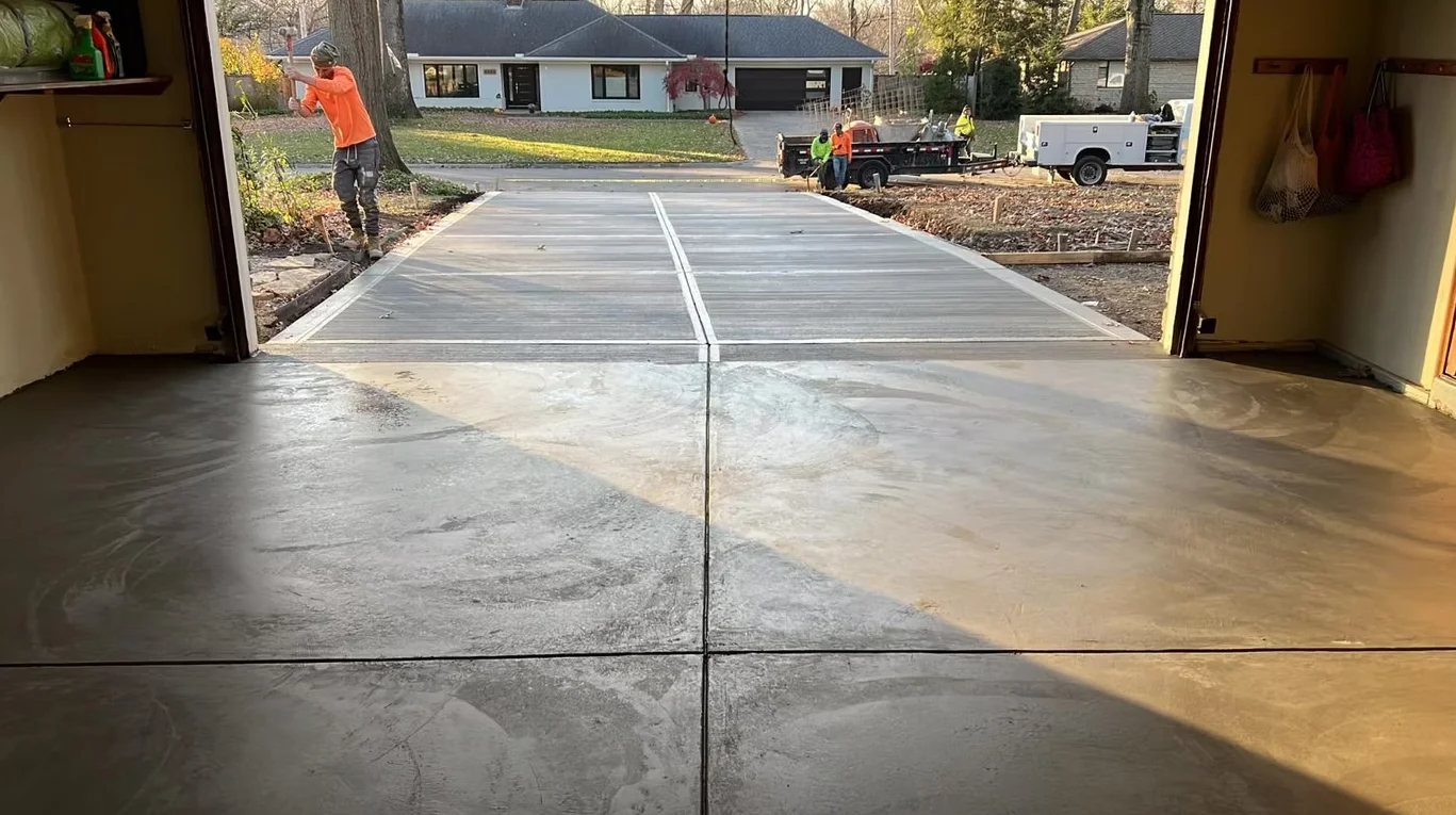 Custom concrete driveway and outdoor living space by Maxima Concrete in Ohio